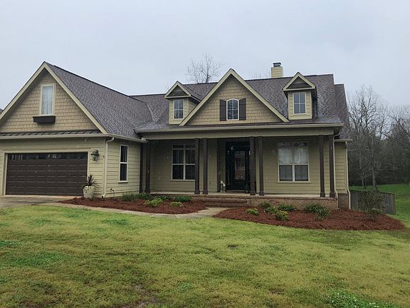 Large covered porch with open area to the right.