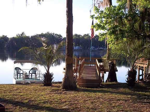 Pontoon boat goes with house