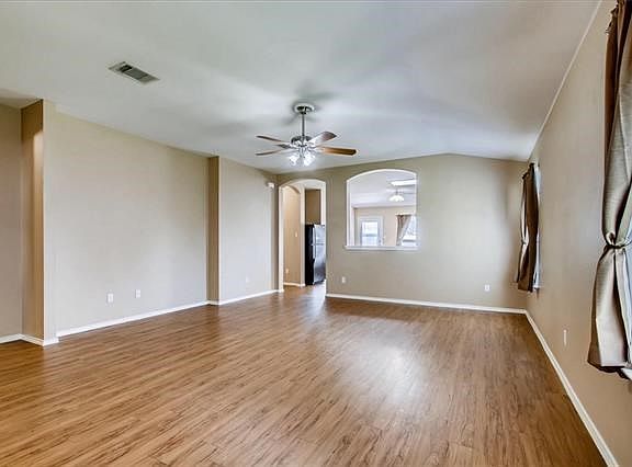 Living room with gleaming wood-look floors! This lovely house is clean and ready to be your new home!