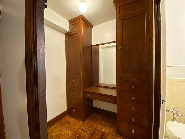 Built-in cabinetry in dressing room.
