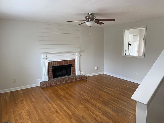Living room with hardwood floors open to Kitchen