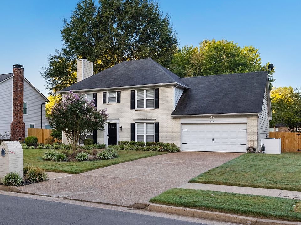 Front of home with two car garage and storage room