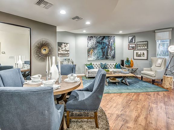 Dining area and living room at Esprit Apartment Homes