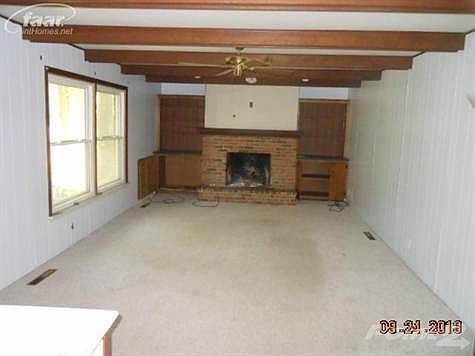 Family room w/wood burning fireplace.