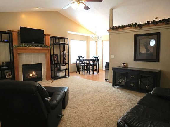 Roomy family room with gas fireplace and vaulted ceiling