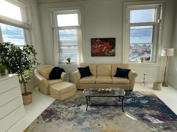 Beautifully decorated living area allows the resident and guests to enjoy spectacular views of the City