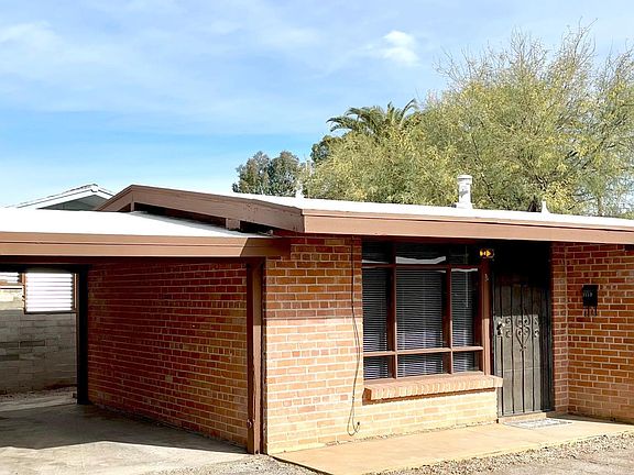 Exterior - carport for one low-profile vehicle (1 parking space per unit).