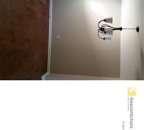 Dining area off of the Kitchen. Notice NEW wood floors, light fixture and paint and trim work.