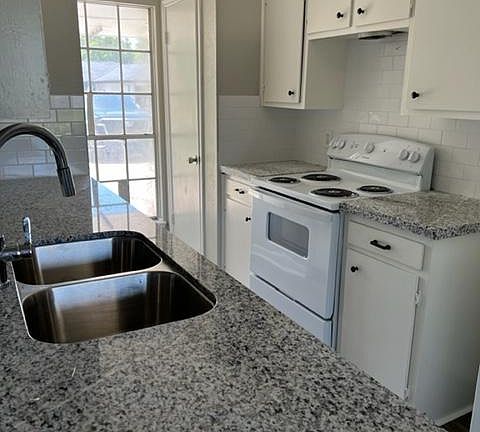 granite countertops and completely new range and dishwasher