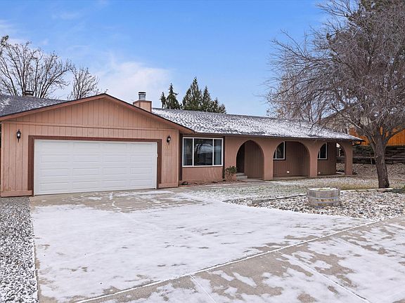 2 car garage; Gravel for parking on side of garage. All new energy efficient windows installed in 2024.