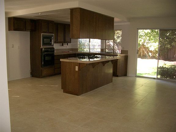 Kitchen with tile floors  recessed lighting and upgraded app