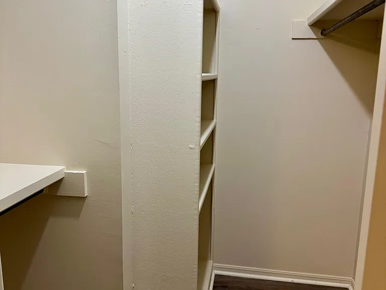 Main bedroom closet with built-in storage