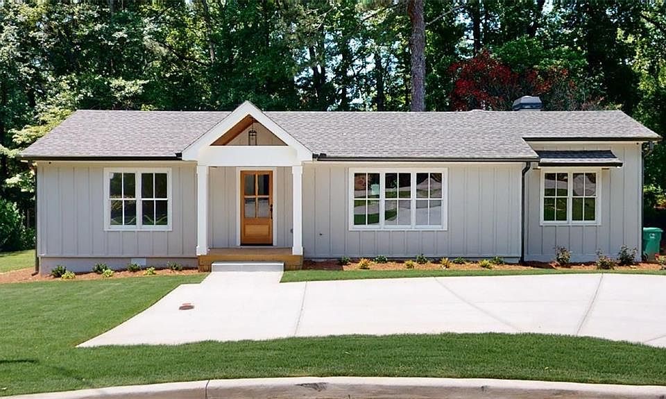 House front in summer before garage/studio construction