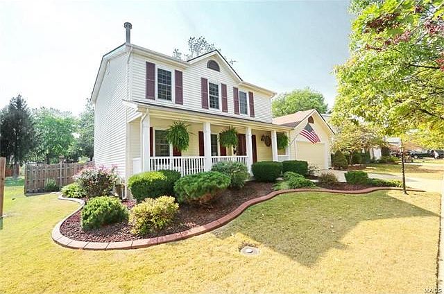 COVERED FRONT PORCH AND EXQUSITE LANDSCAPING