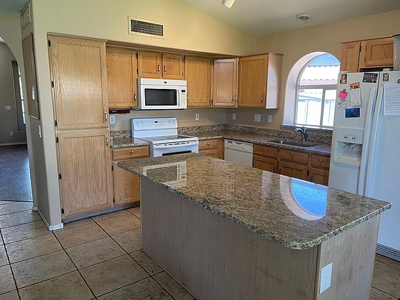 Kitchen showing the gorgeous just installed granite countertops.