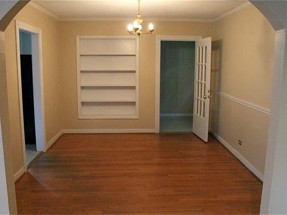 DINING ROOM WITH BUILT IN SHELVES