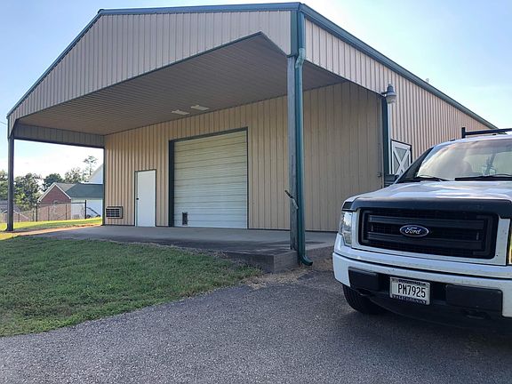 The storage area in the barn that is available for an extra $40 monthly is accessed via the entry door on the far left.