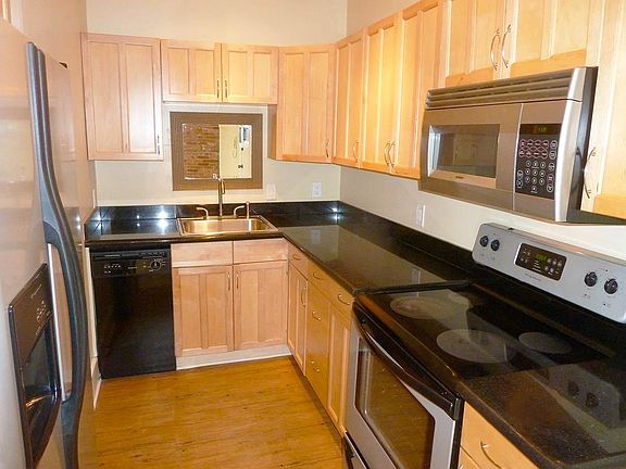 Granite Counters, Stainless Silver and Black Appliances, Maple Cabinets