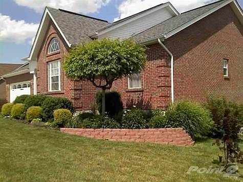 Mature landscaping adds to the beauty of this home.