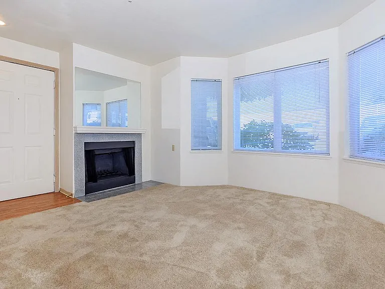 A Classic 2 Bedroom 2 Bath Living Room with Fireplace at Brookhaven Apartments in Federal Way, Washington