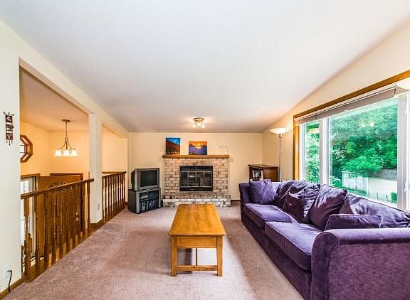 Living room with large windows providing lots of light. East facing.