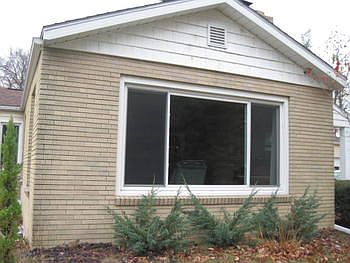 Large picture window in the living room allows for plenty of natural light.
