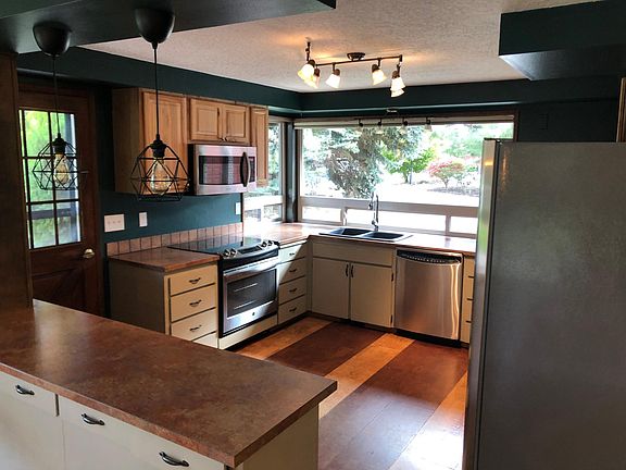 Open kitchen with plenty of storage and updated appliances.