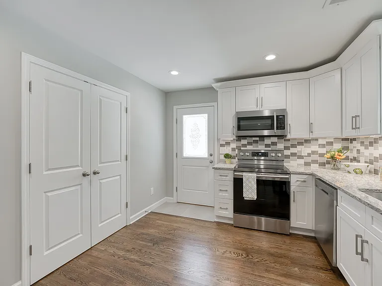 A convenient laundry closet with washer and dryer connections is located in the kitchen.