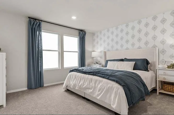 Master bedroom with two large windows and forest & valleys views. Direct southern exposure.