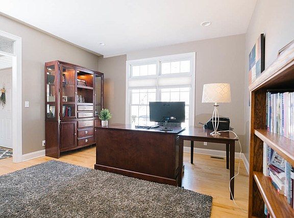 A versatile room with options. It has all of the right features to be a home office or formal sittin