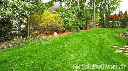 Backyard : Spacious deck overlooks largest backyard in the neighborhood.