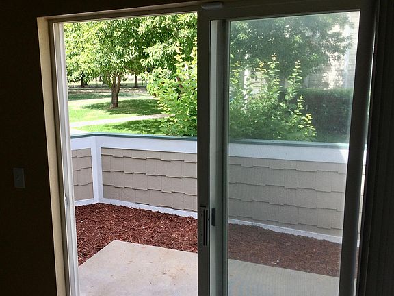 View from kitchen into small rear private courtyard at back of property