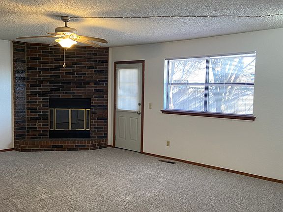 Large Living Room with Gas Fireplace and Access to Backyard