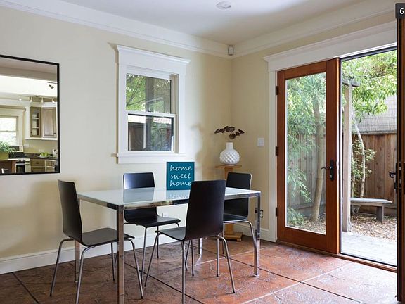 Dining area leading to private backyard