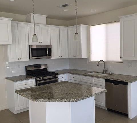 Granite & white subway tile backsplash