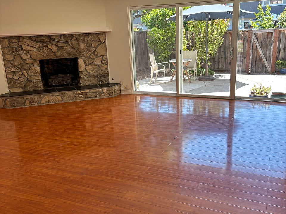 Open living/ dining room with hardwood floors