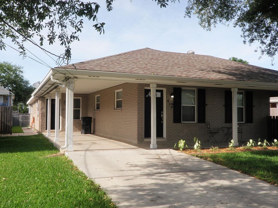 Carport can accommodate two vehicles.