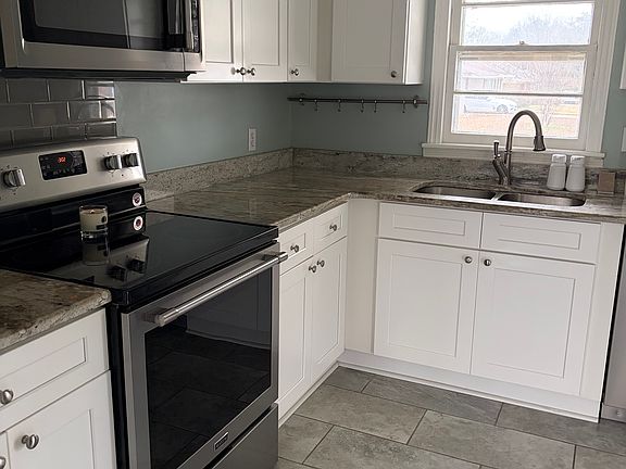 Updated kitchen with stainless appliances.