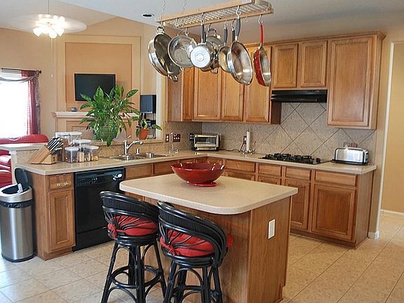 Spacious island kitchen with a breakfast room overlooking the living room