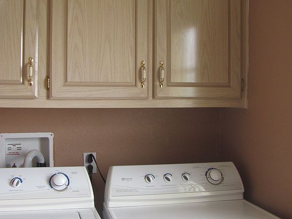 Washer and dryer near back door mud room