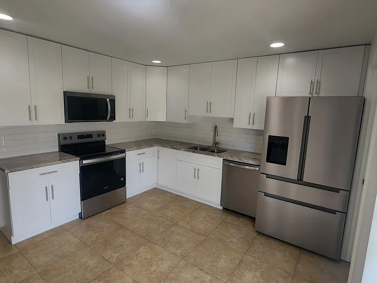 Newly remodeled kitchen with new all wood cabinets with soft close doors, Quartz counter tops and new appliances.