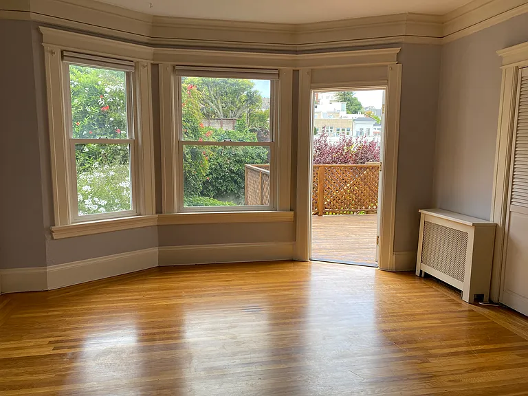 Living room with door to deck and yard
