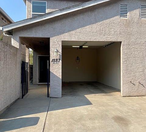 Rear side Driveway. Automatic garage door opener.