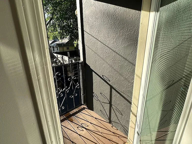 master bedr door leading to exterior stairs-- wider than the spiral