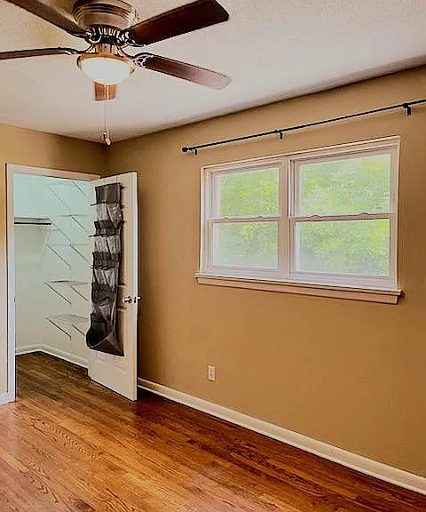 The pacious BR with lighted ceiling fan.