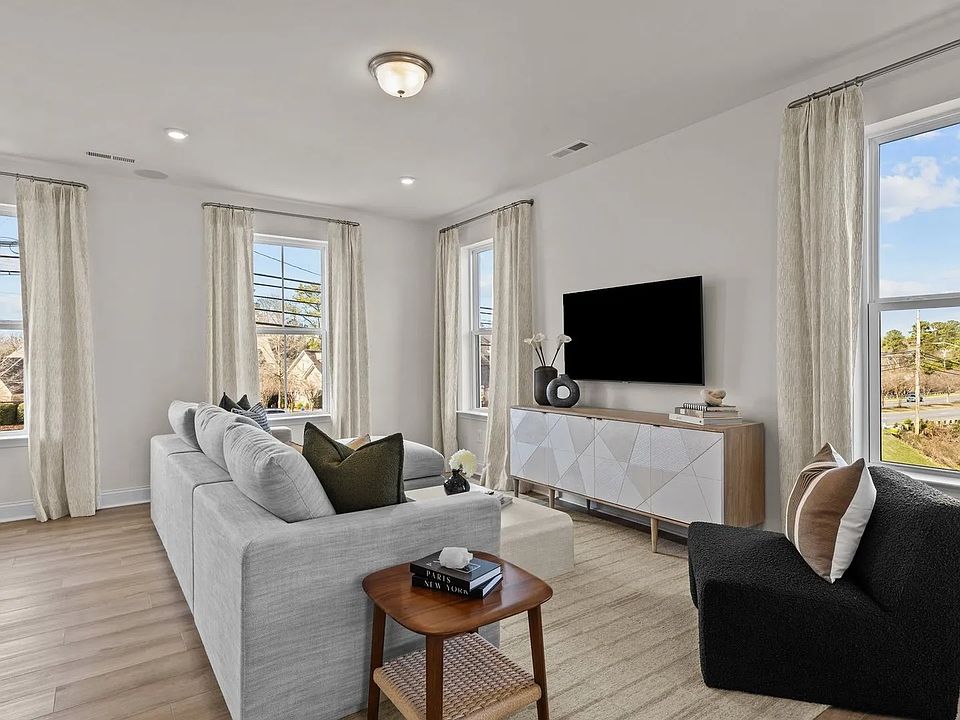 Spacious, Sunlit, End Unit Family Room with Elevated Ceilings Large windows. DRB Homes, Alexander