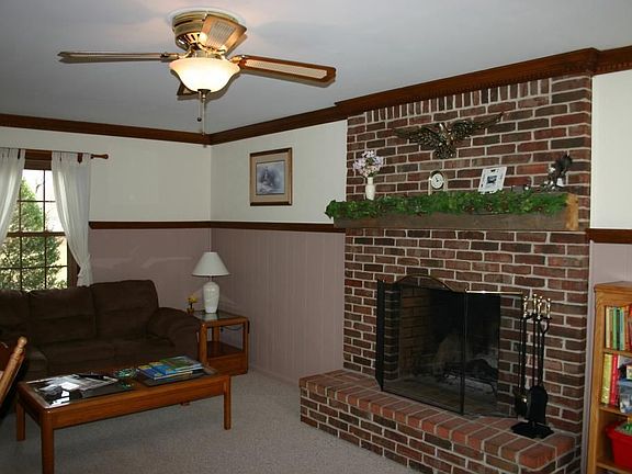 Family room with wood burning brick fireplace 