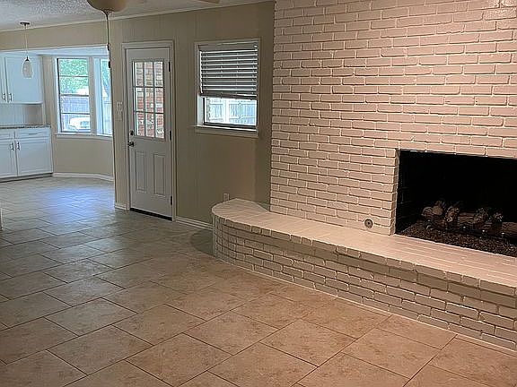 Den showing fireplace