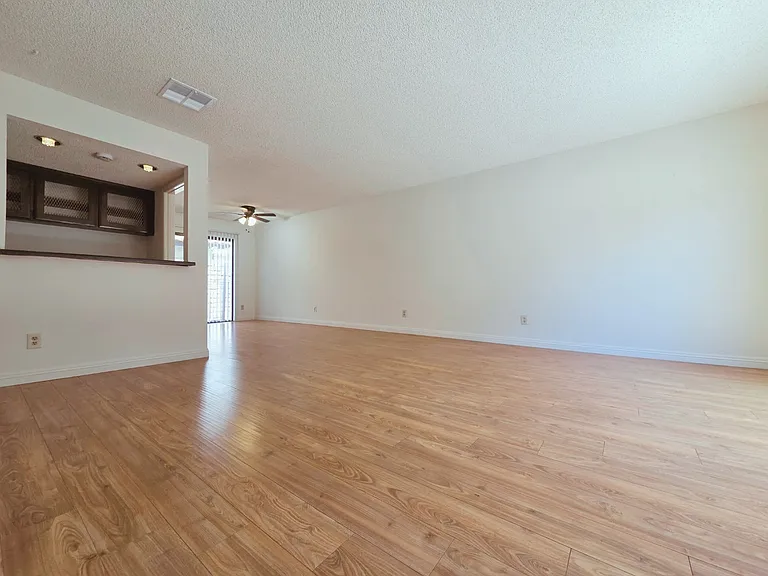 Living Room w/ Bar Area and Dining Area