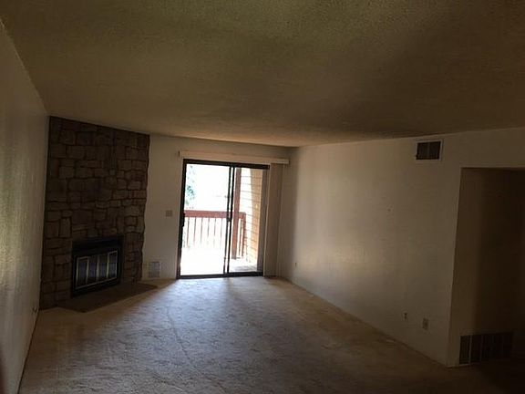 Family room, fire place and balcony